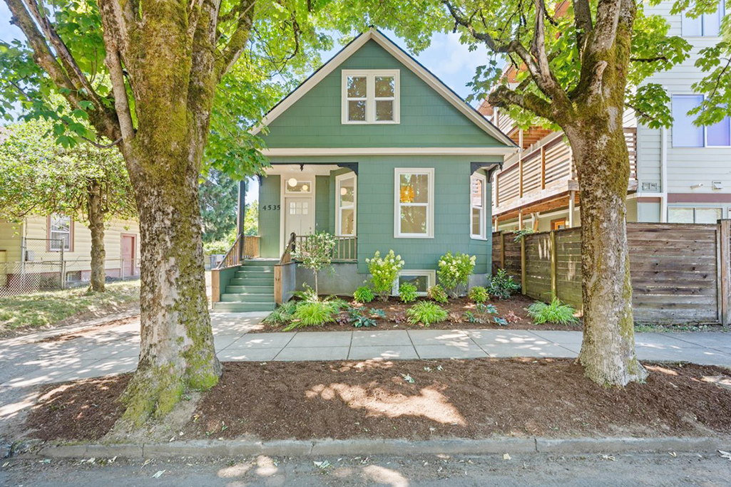 NE Portland home remodel exterior with modern lighting, new landscaping, front door, trim, and Milgard windows