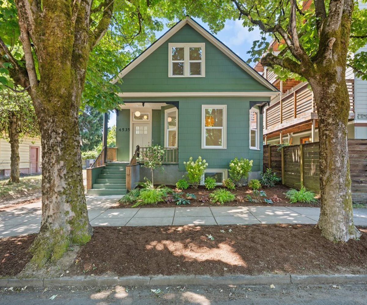 NE Portland home remodel exterior with modern lighting, new landscaping, front door, trim, and Milgard windows